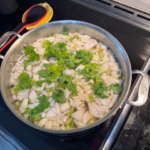 Easy homemade vegetable soup cooking in a stainless steel pot on the stovetop