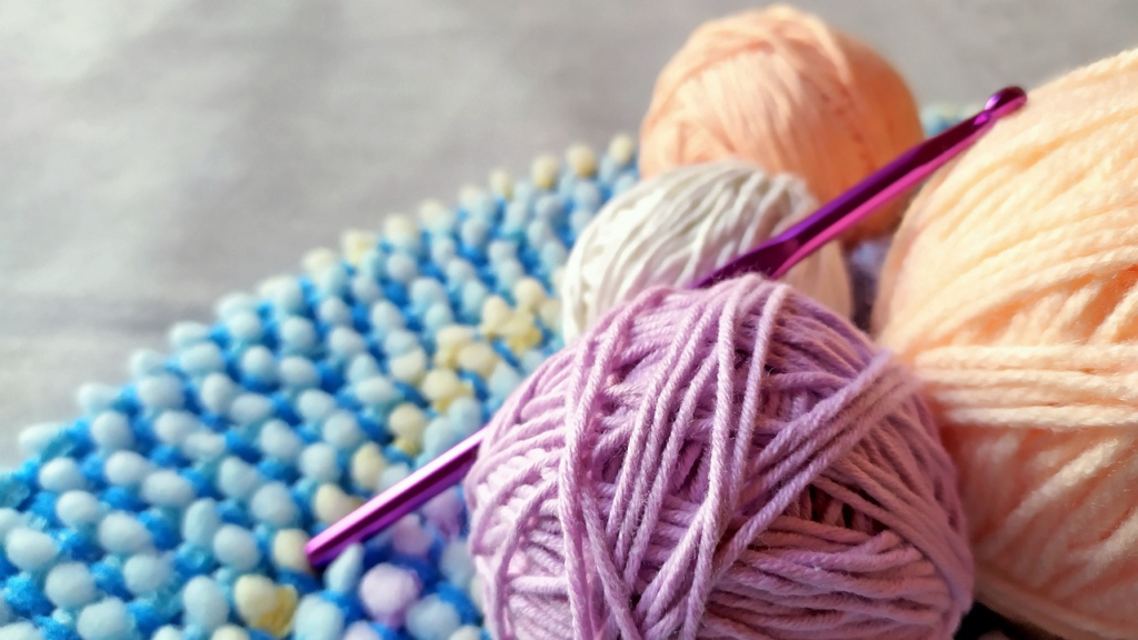 Yarn and crochet hooks for a beginner crochet dishcloth pattern project