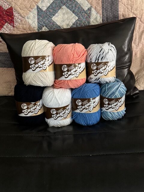 Cotton yarn skeins commonly used for crochet dishcloths and kitchen projects