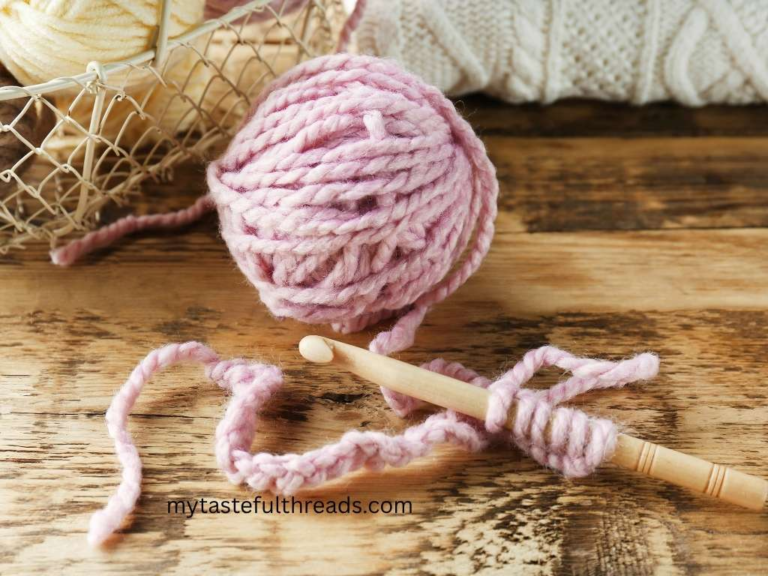 hook and yarn flay lay for beginner left-handed crochet on wooden table