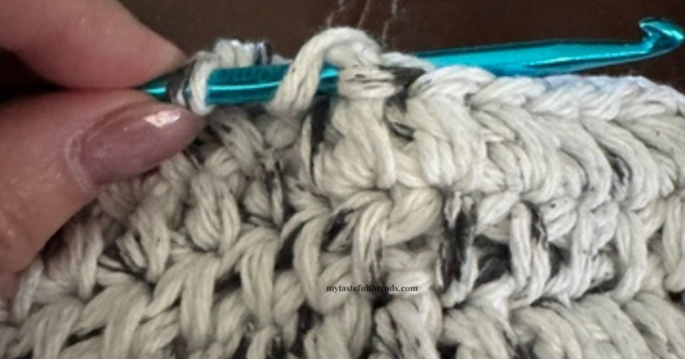 Clover crochet hook working half double crochet stitch in cotton yarn