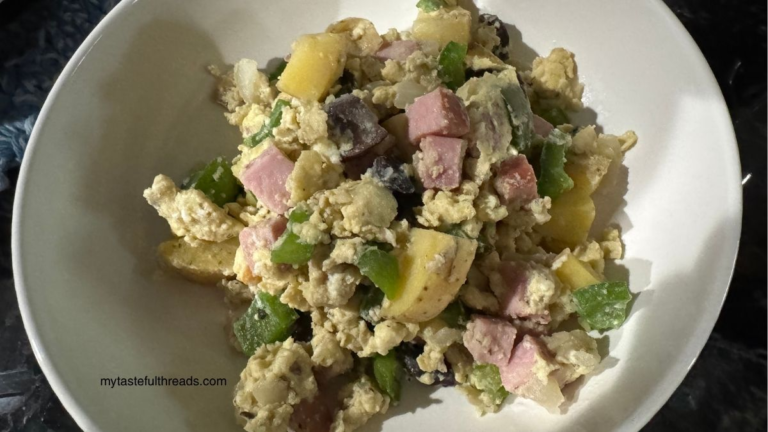 A one pan breakfast skillet with eggs, ham, potatoes, mushrooms and goat cheese.