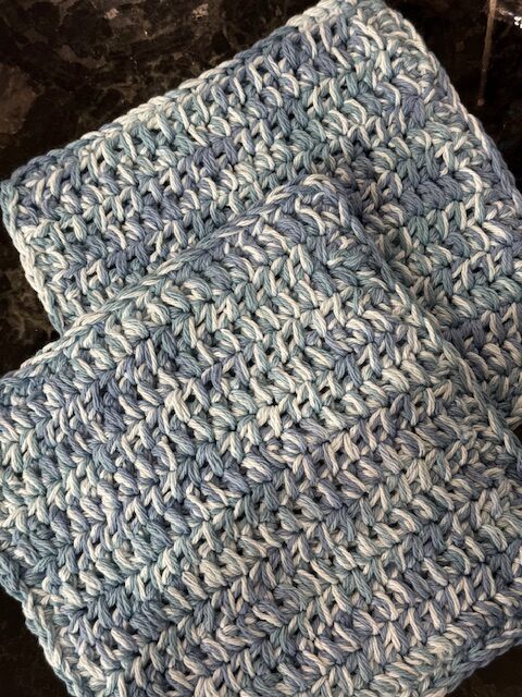 Handmade blue and white variegated crochet hot pad pattern, beginner-friendly cotton yarn project